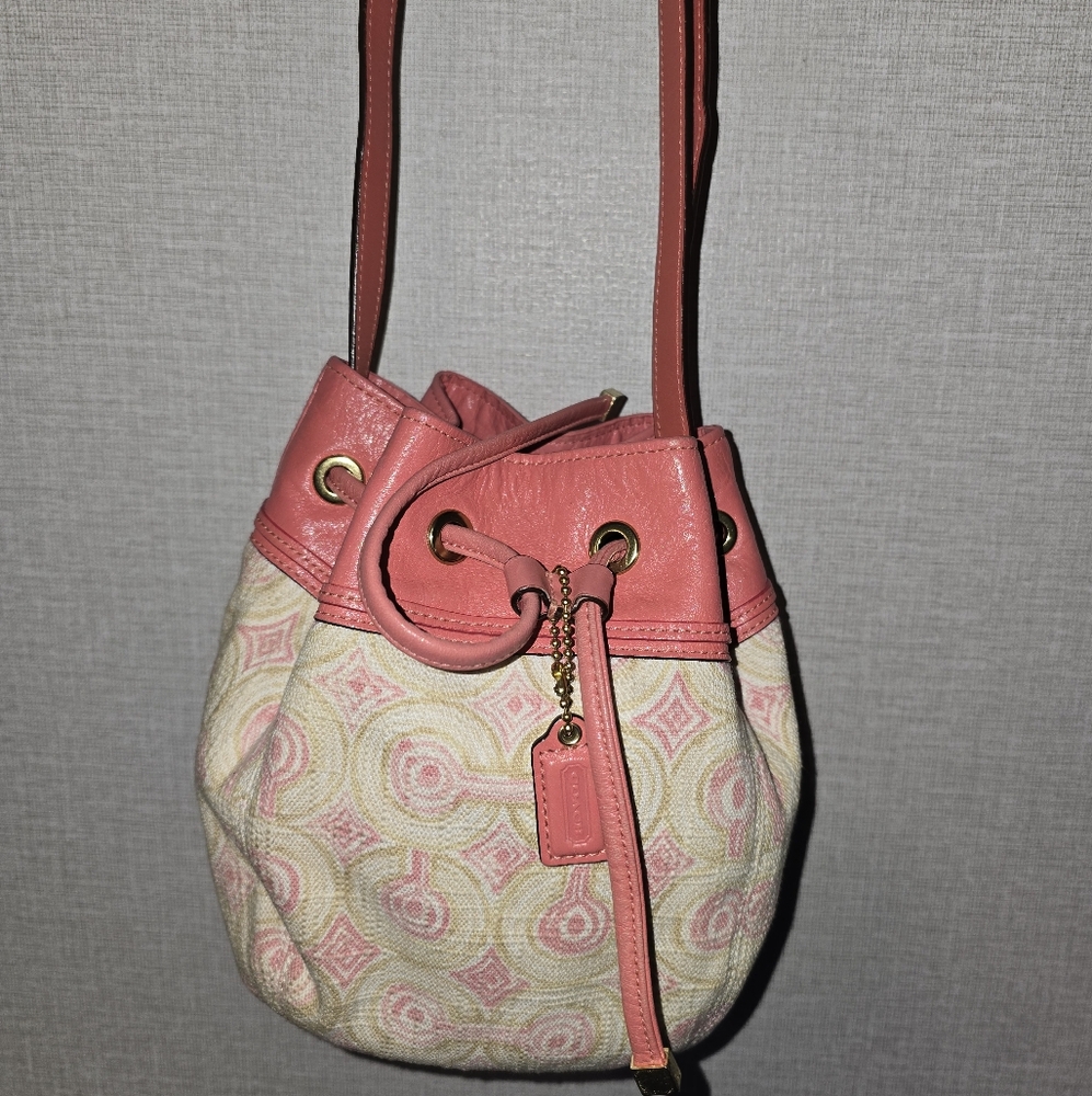 Coach Audry Opt Art Swirl small drawstring bucket bag in pink and khaki canvas
